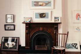The picture is above the fireplace.